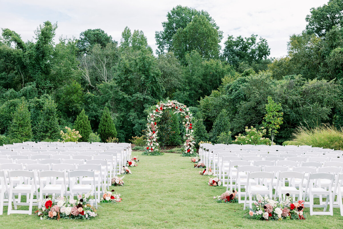 Outdoor ceremony with red and white