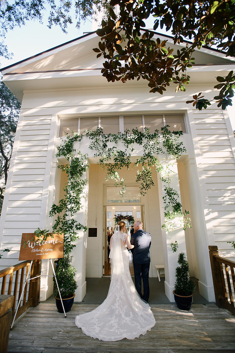 Bride and her father make their entrance into the meeting house at carillon beach
