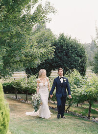 Seattle-Washington-Wedding-Venue-Chateau-Lill-bride-and-groom-walking-through-vineyard