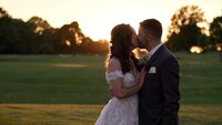 fallback shared on Invalid Date | a bride and groom kissing in front of a sunset