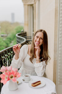 fallback shared on Invalid Date | Danielle smiling and holding a macaroon