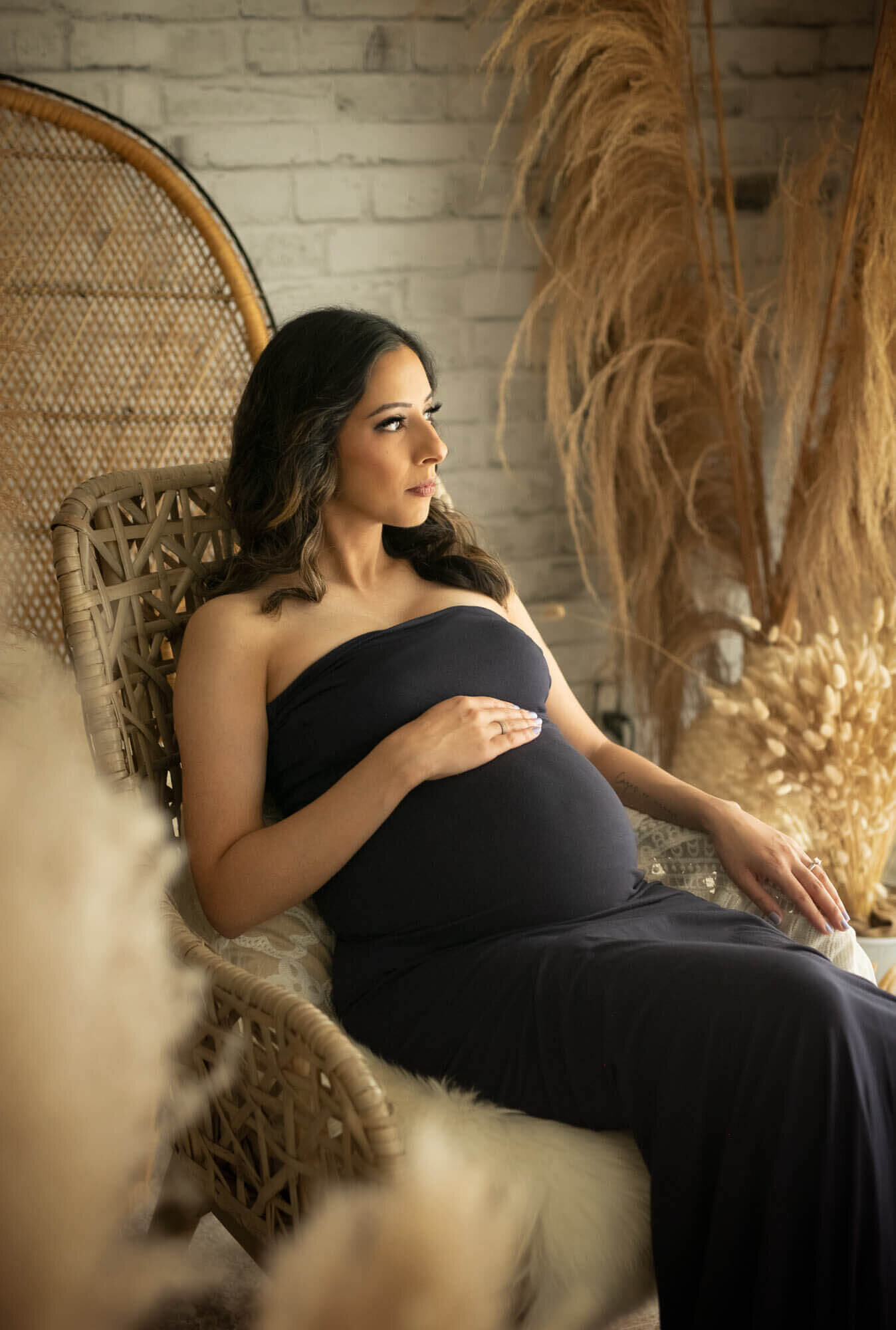 Maternity photo shoot with navy fitted strapless gown