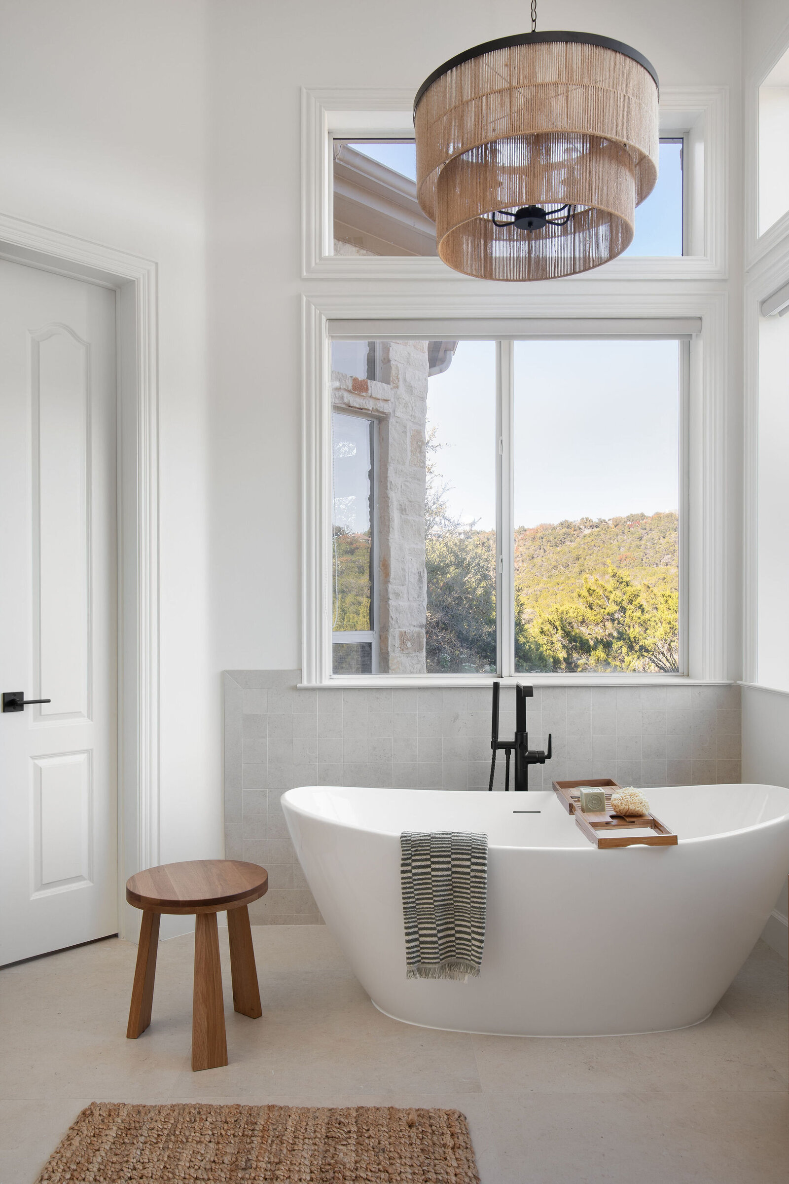 Nuela Designs Free Standing Tub with Woven Chandelier Primary Bathroom