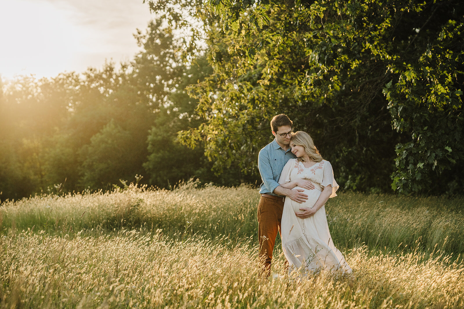 expectant parent photoshoot in a boston field