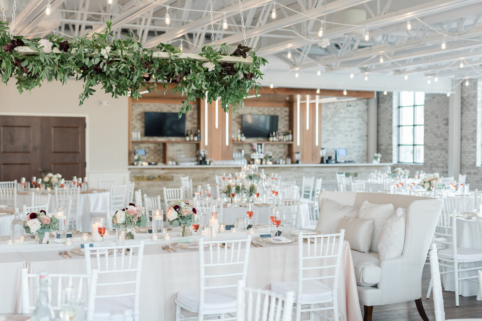 Wedding table scapes with greenery in lights
