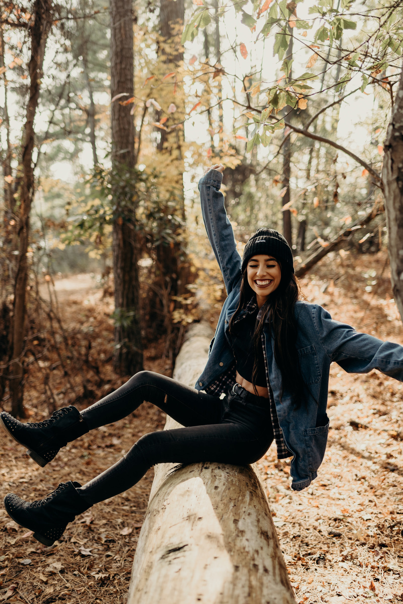 celebrating on log