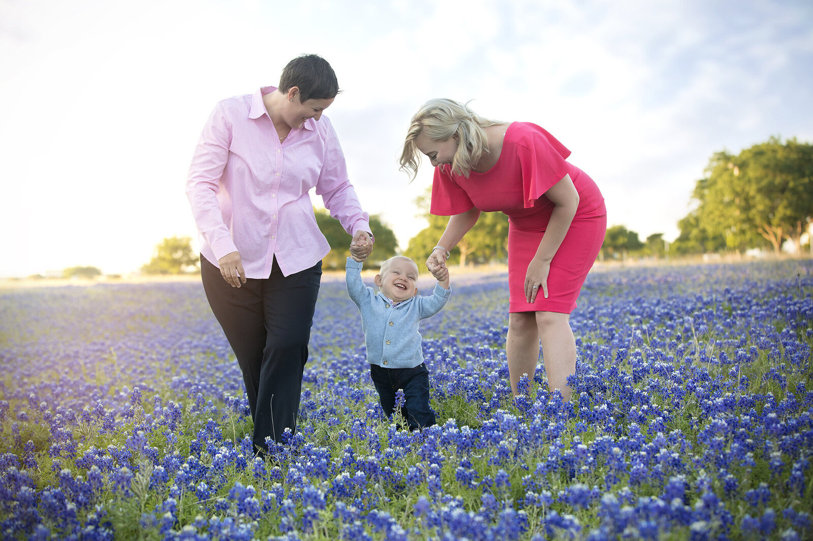 Mothers in field of bluebonnets with infant son LGBTQ Photography