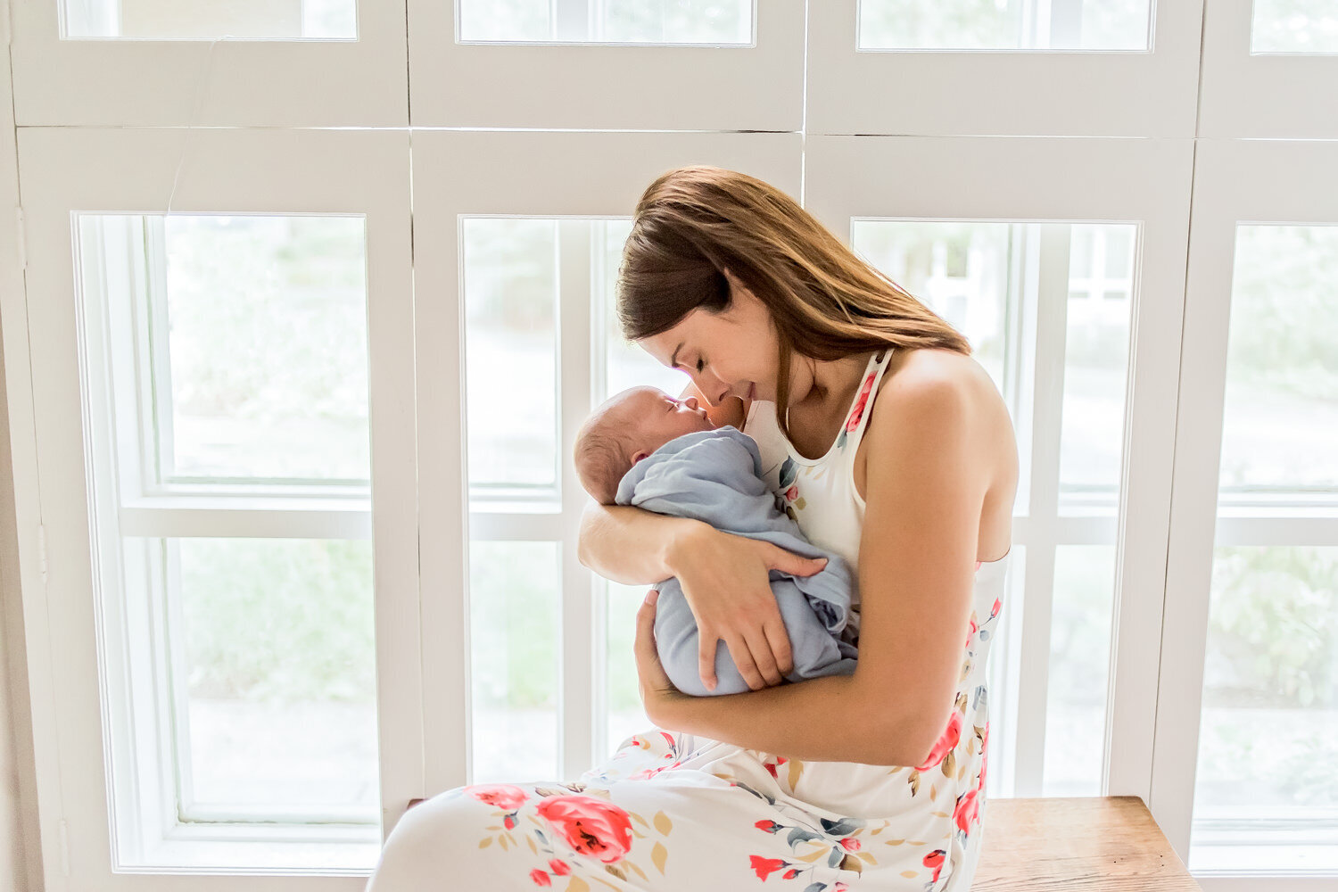Mother looking lovingly at newborn baby