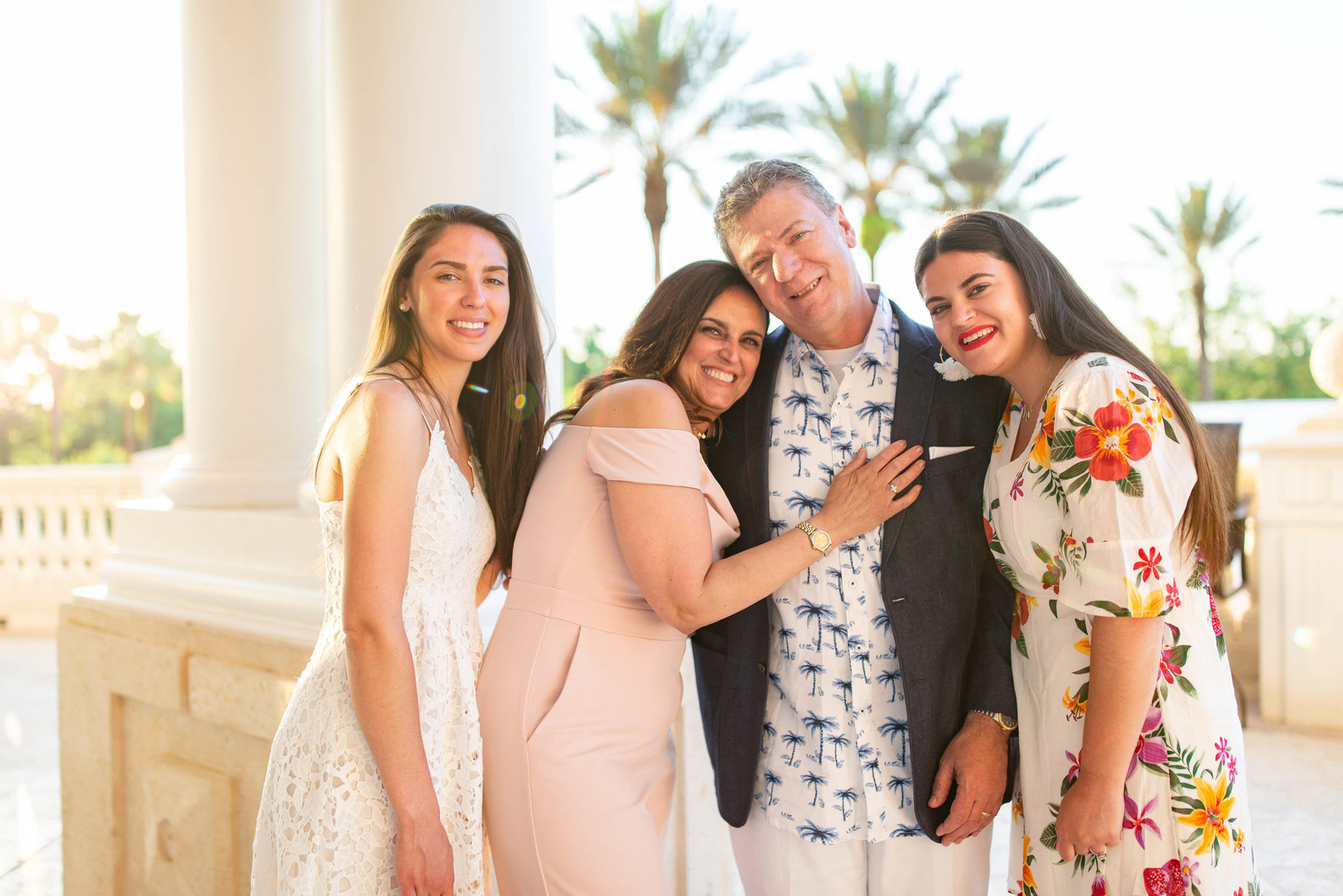 Tampa Wedding Photographer capture family photo of bride's family during rehearsal dinner