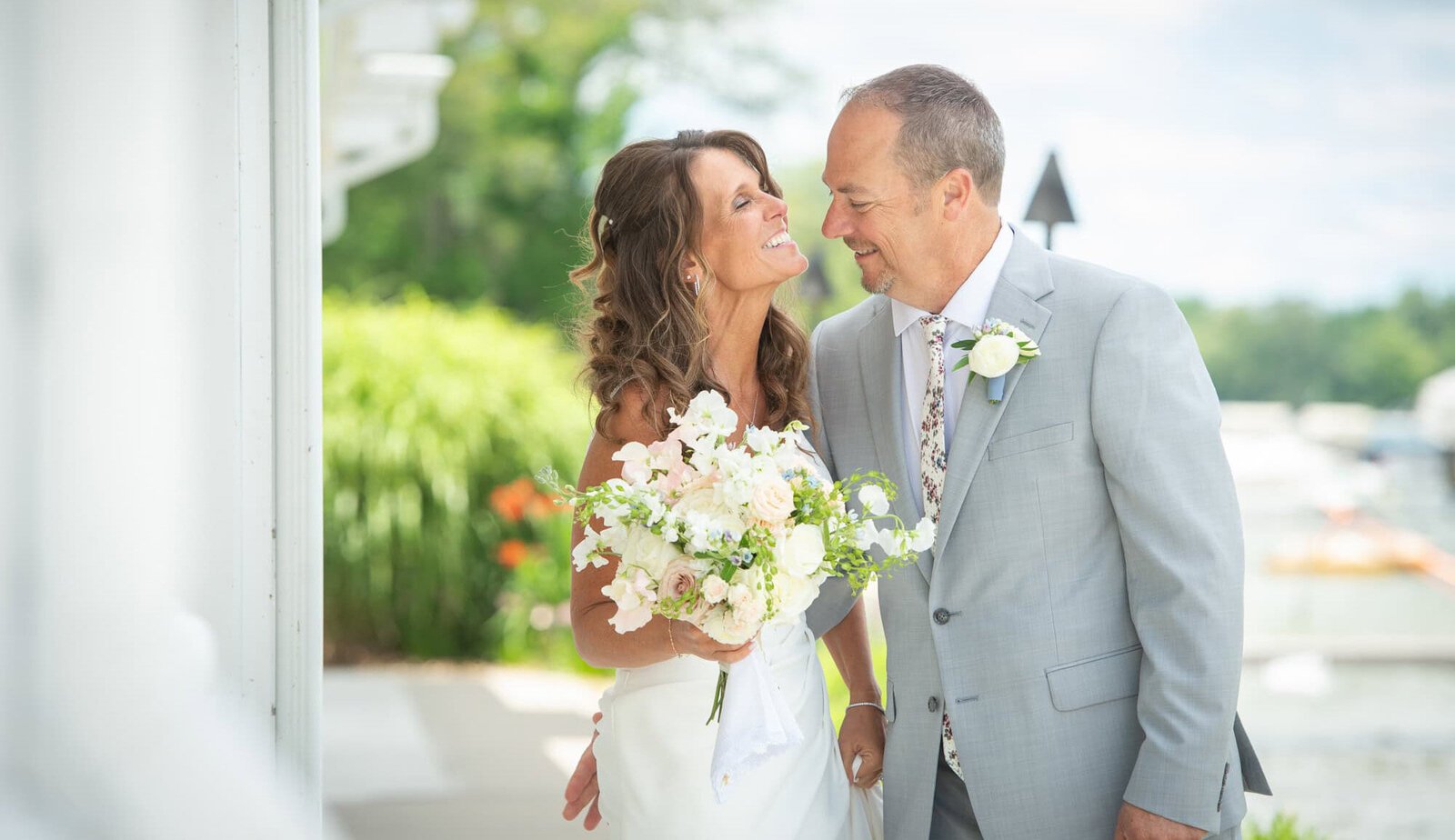 groom leans into bride on their wedding day