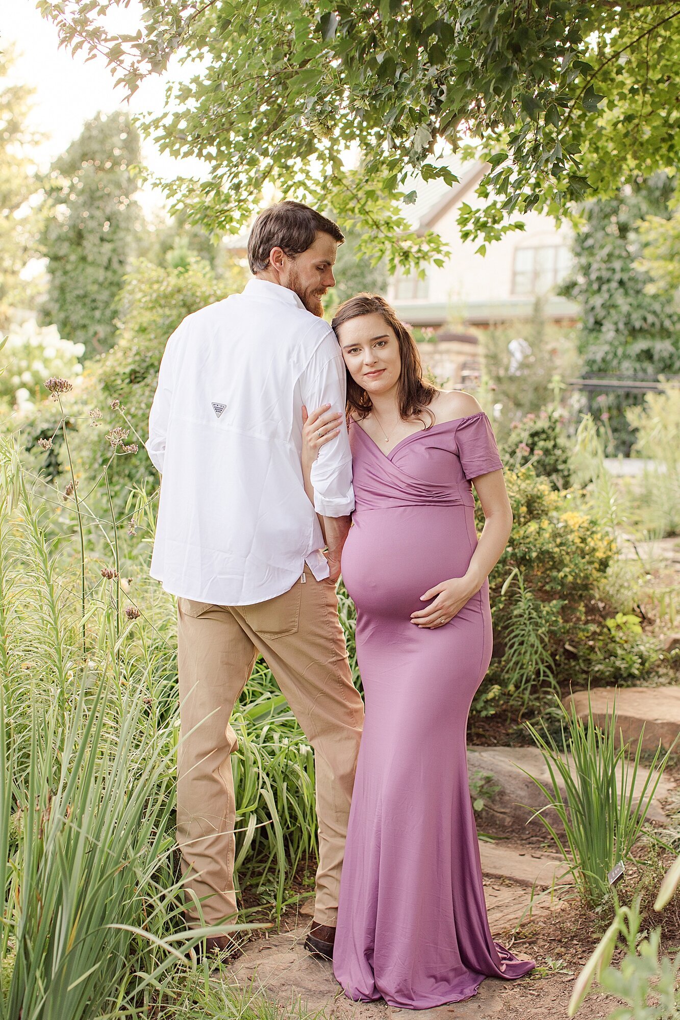 maternity picture of mom and dad in a garden