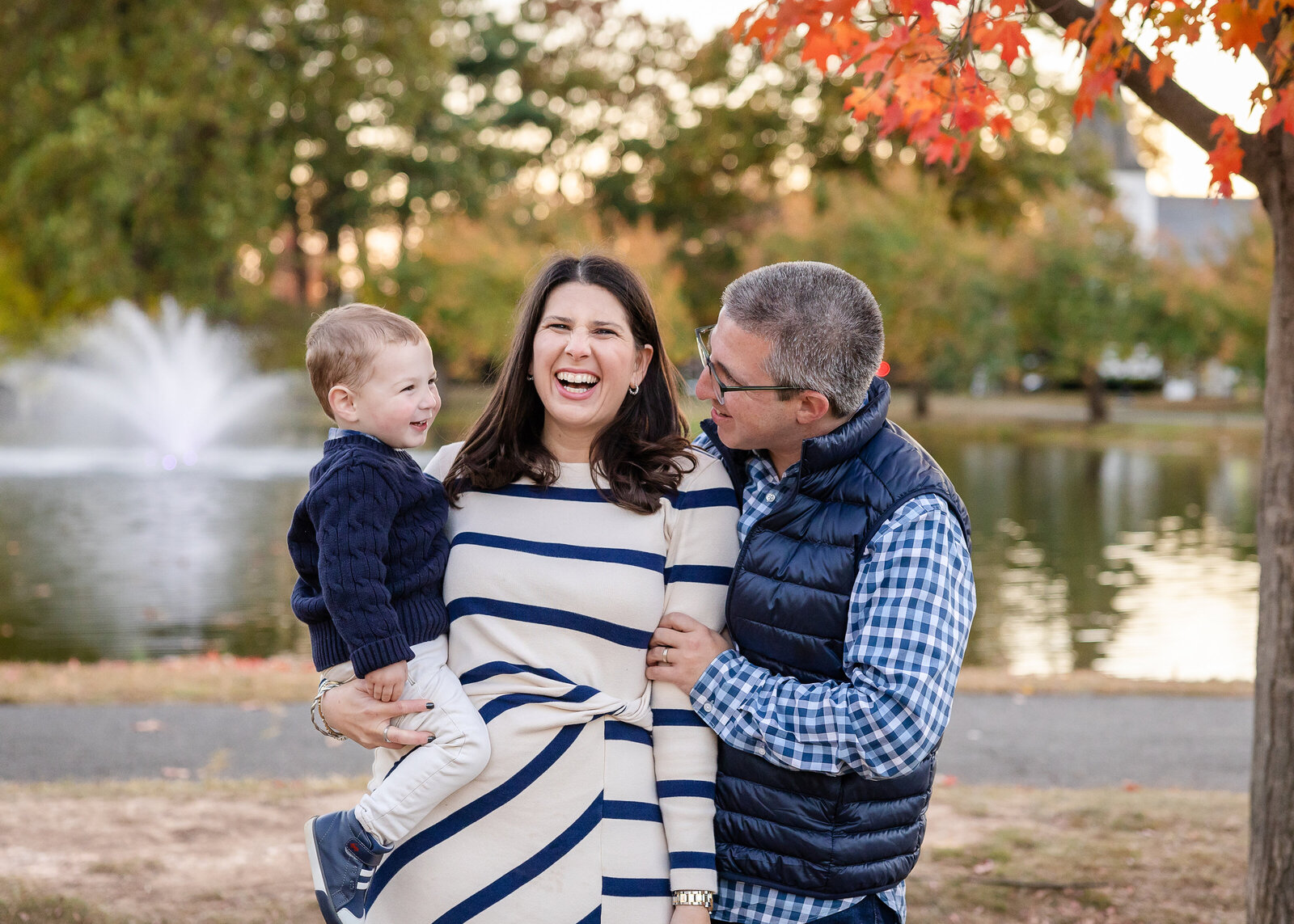 Laughing family at an Essex County, New Jersey park in the fall.
