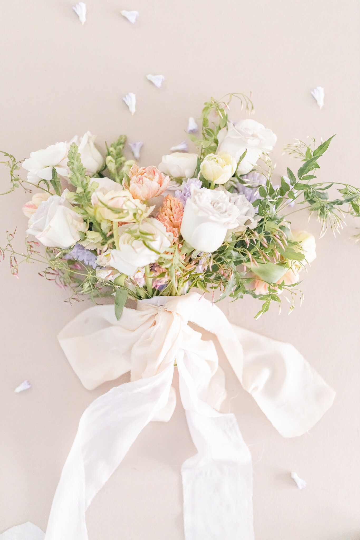 bright light and airy wedding photo of bridal bouquet flowers
