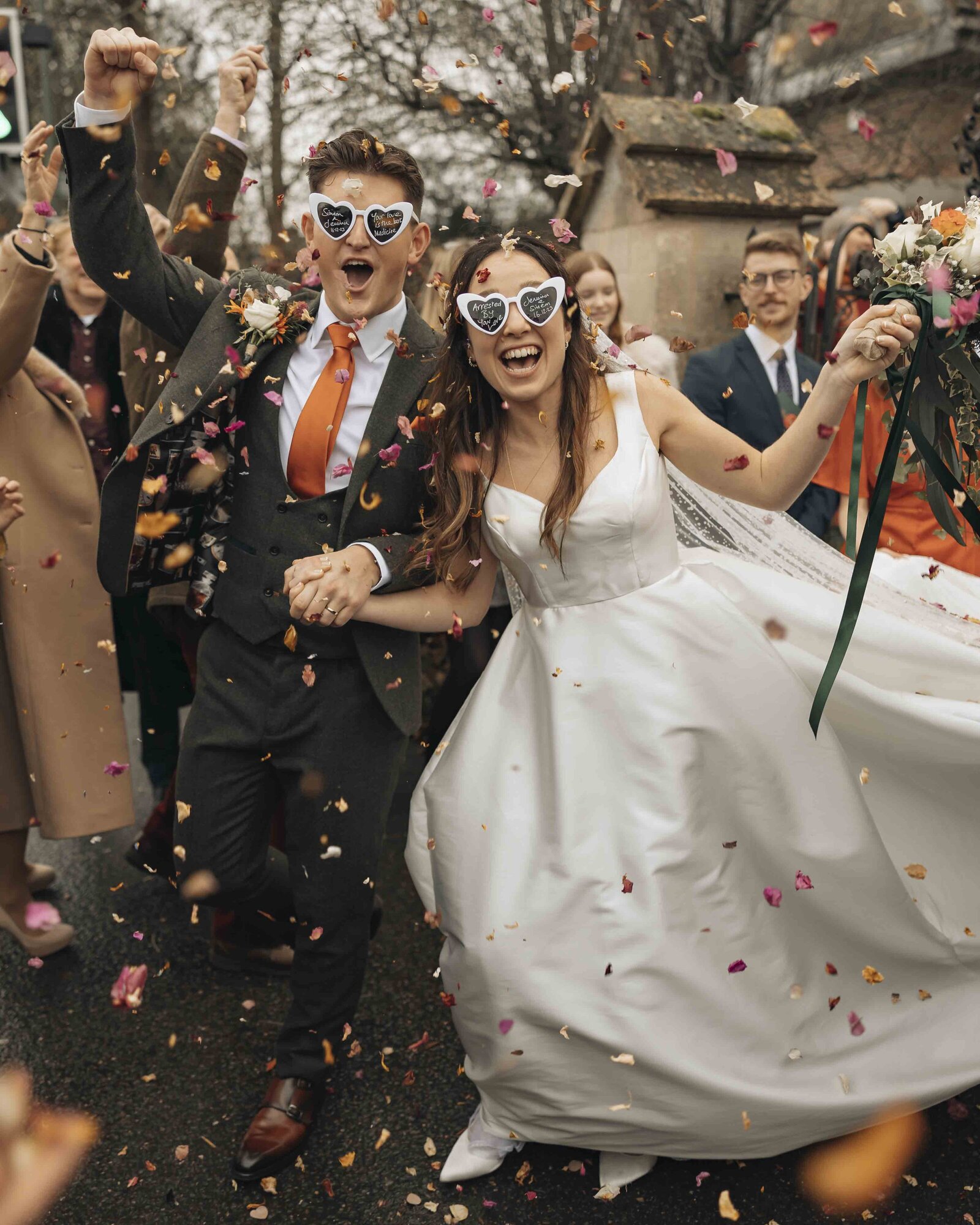 bride and groom confetti shot with joy