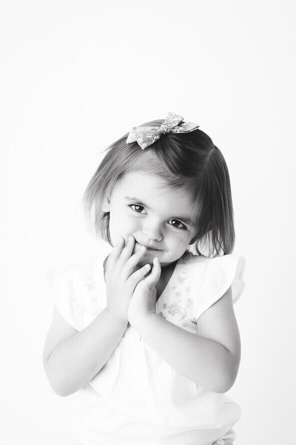 Girl looks at camera for her personality photo session.
