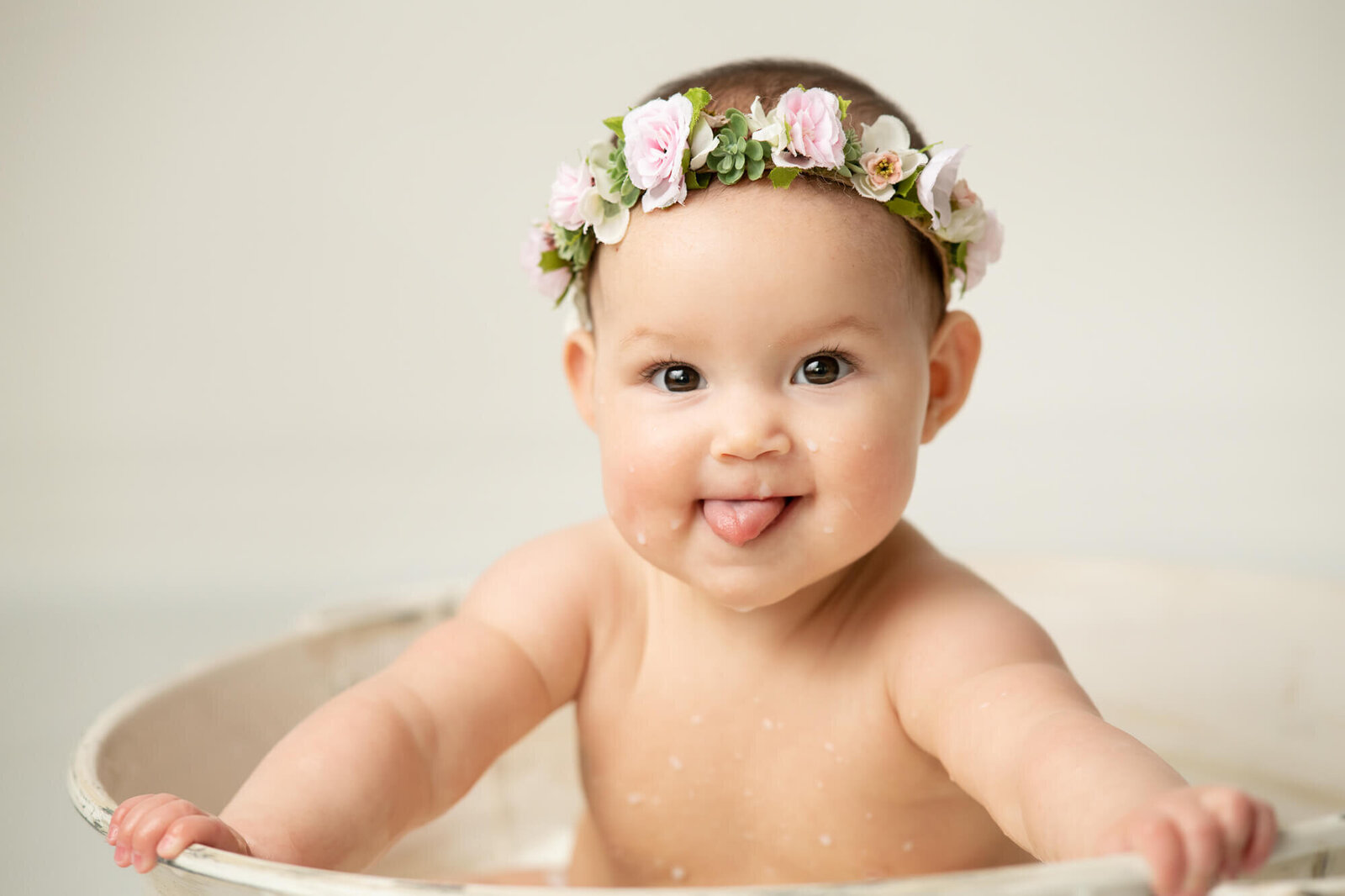 Baby girl in vintage tub with floral crown
