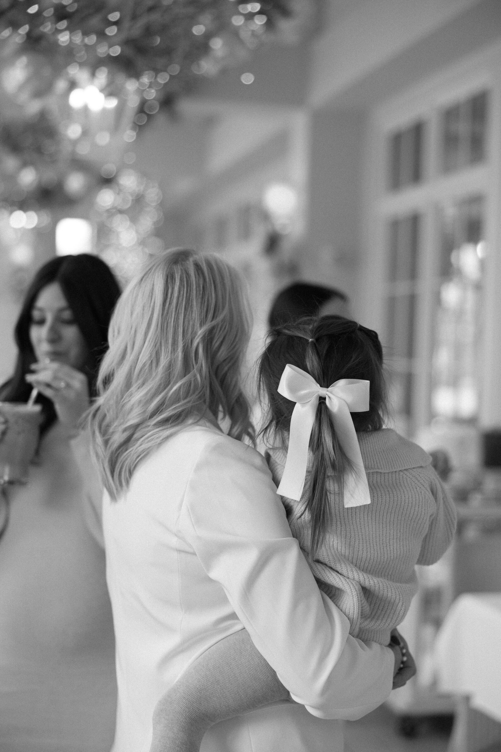 photo of grandmother holding her granddaughter at baby shower at Cake Bake