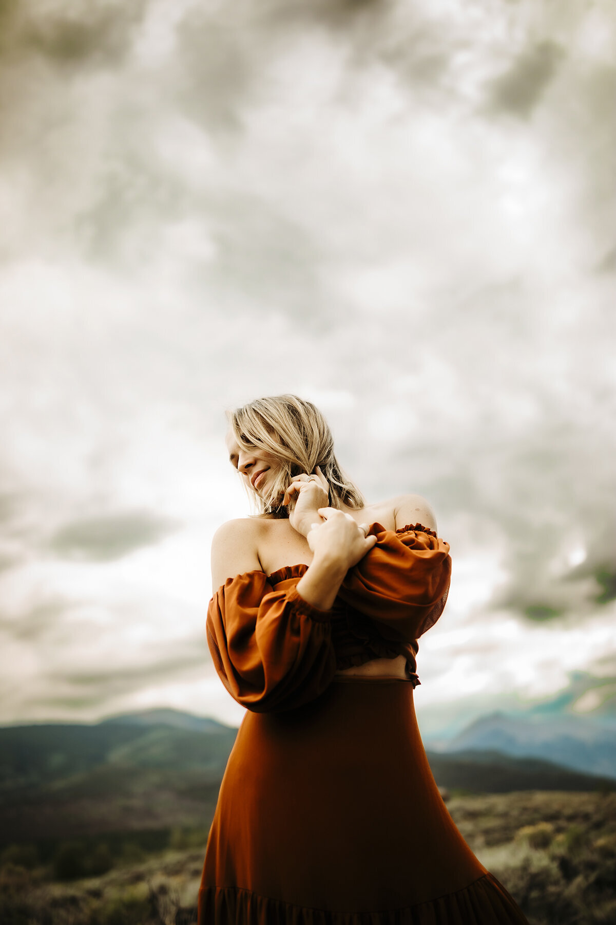 beautiful woman posing in the mountains