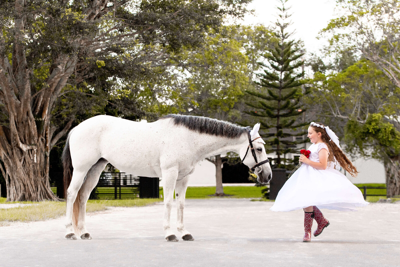 Photo of girl dancing with her horse in a dress, photographed by South Florida Equine/Pet Photographer Katy In Design