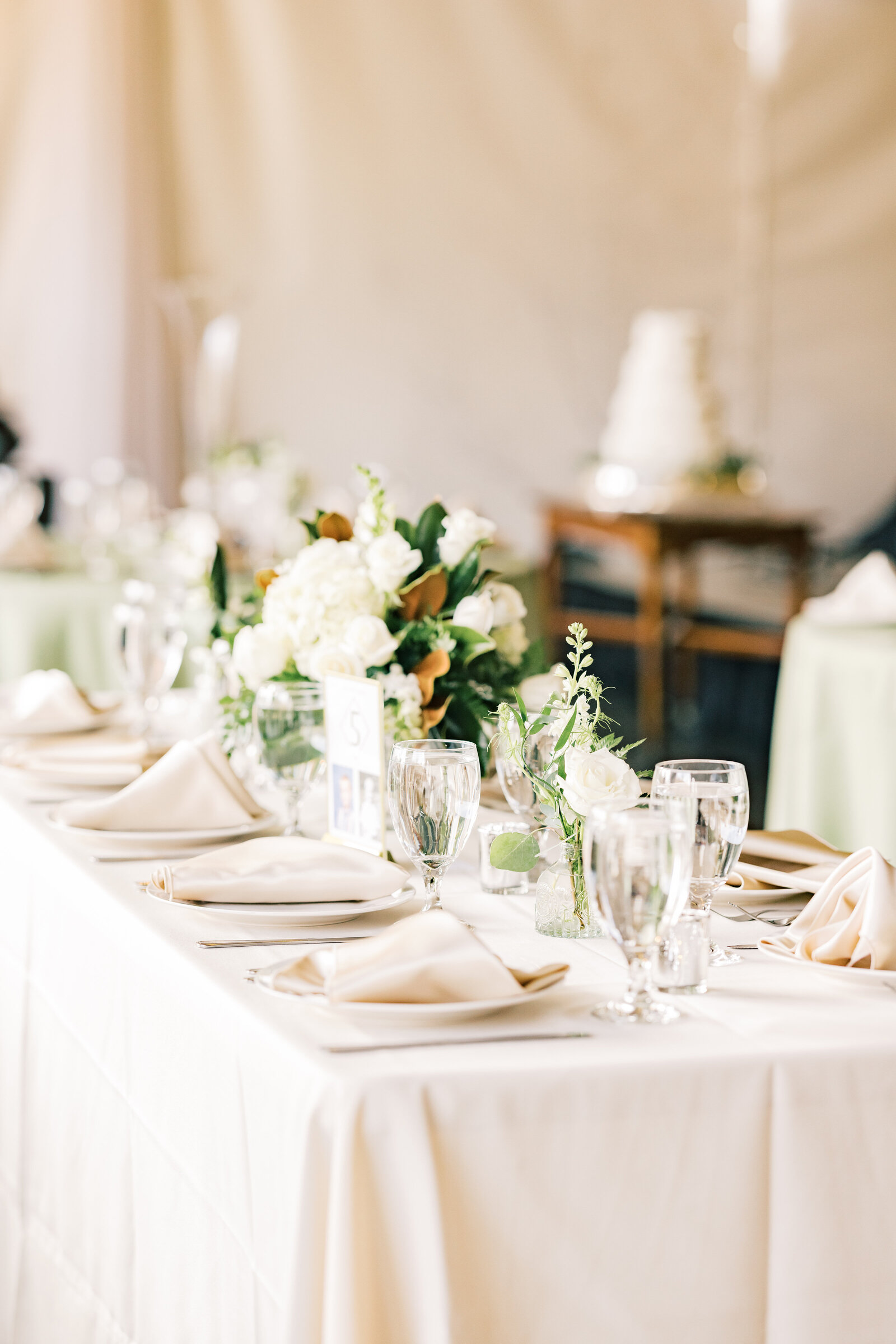 Luxurious wedding reception decorations at Inola in Blue Ridge, GA, featuring refined floral arrangements, romantic lighting, and sophisticated table settings