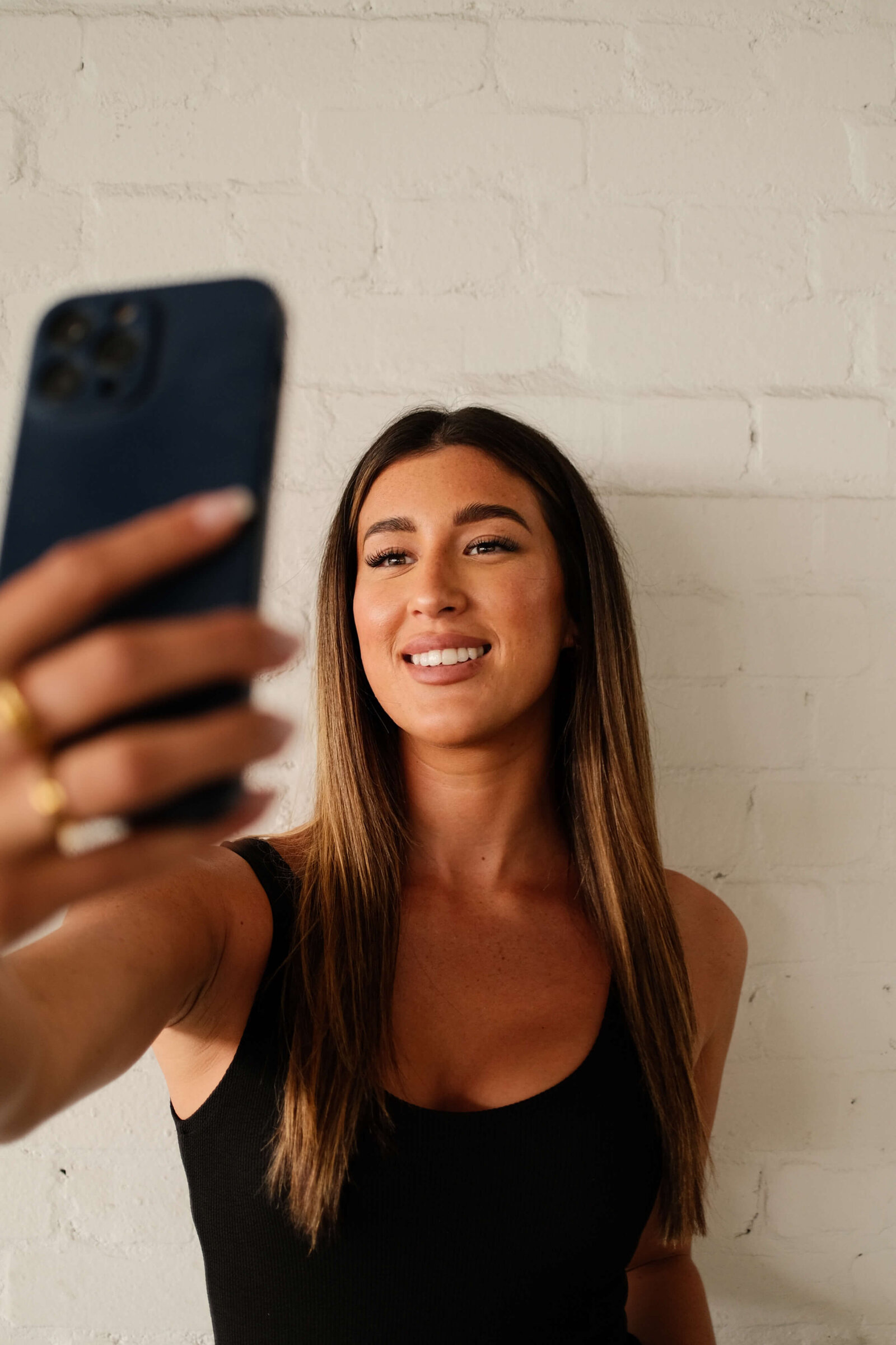 social media manager smiling to the phone