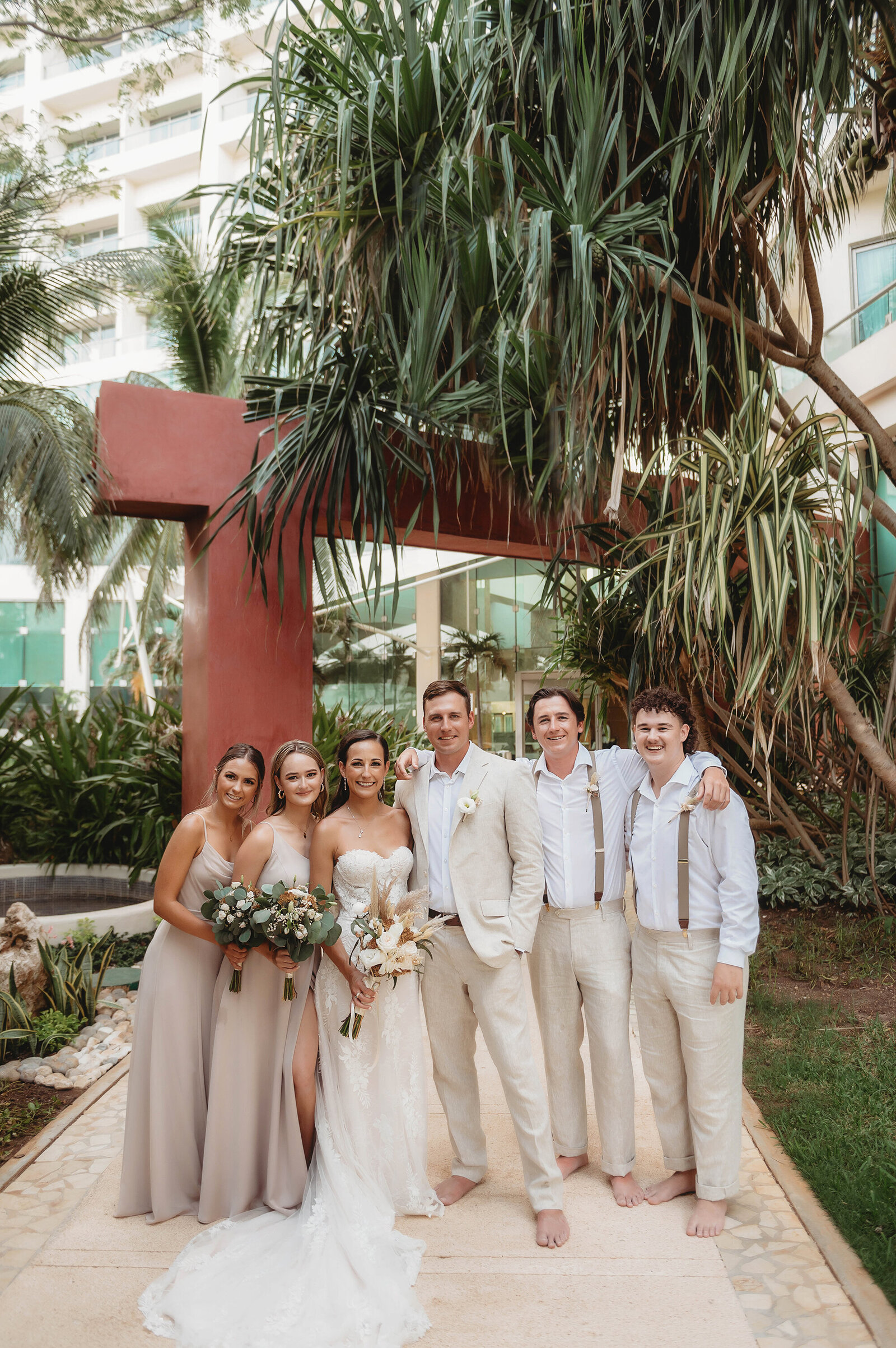 Bridal Party poses for portraits after Elopement Ceremony at Live Aqua Resort in Cancun, Mexico.