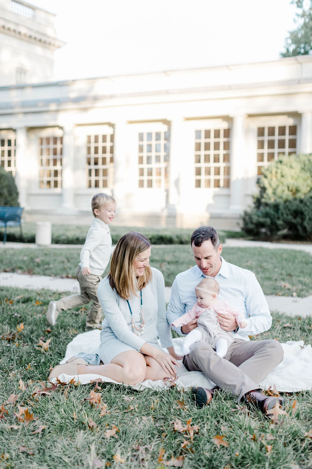A sweet family moment captured on film during a fall mini session at the VMFA in Richmond, Virginia