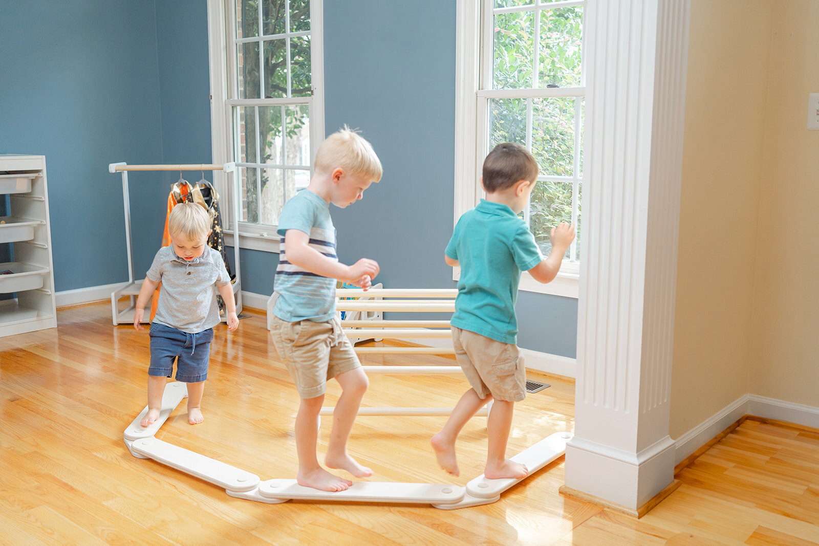 kids playing on a balance beam during lifestyle product picture in Leesburg,VA