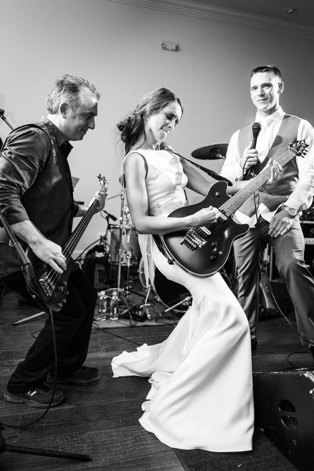 Bride plays guitar at The Greystone in Mandeville