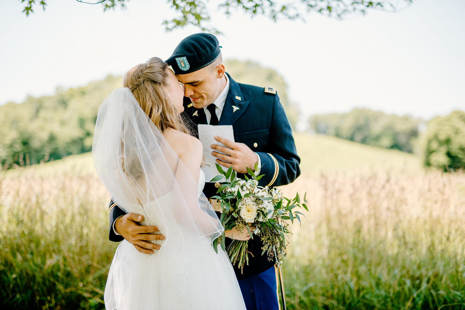 bride and groom  hugging in a field  in Missouri