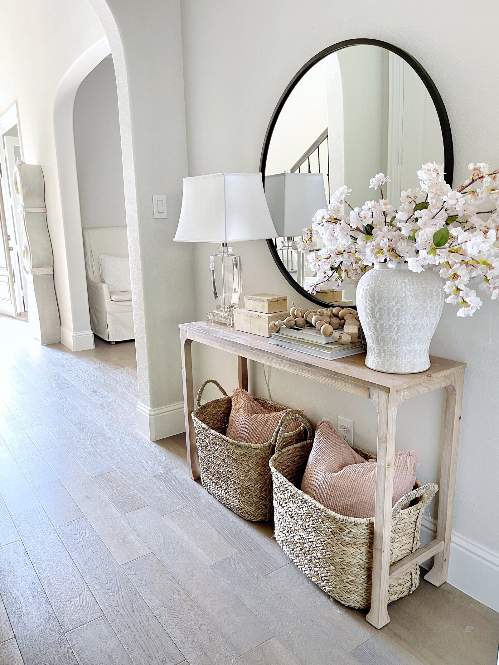 Entryway space featuring a console table decorated