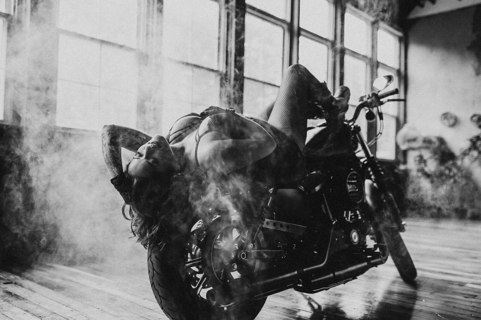 portrait of a woman with her motorcycle