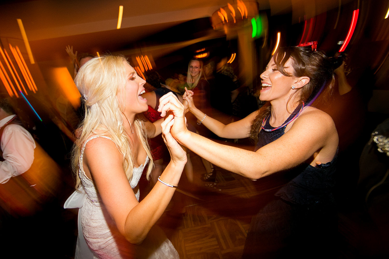 bride dancing with friend