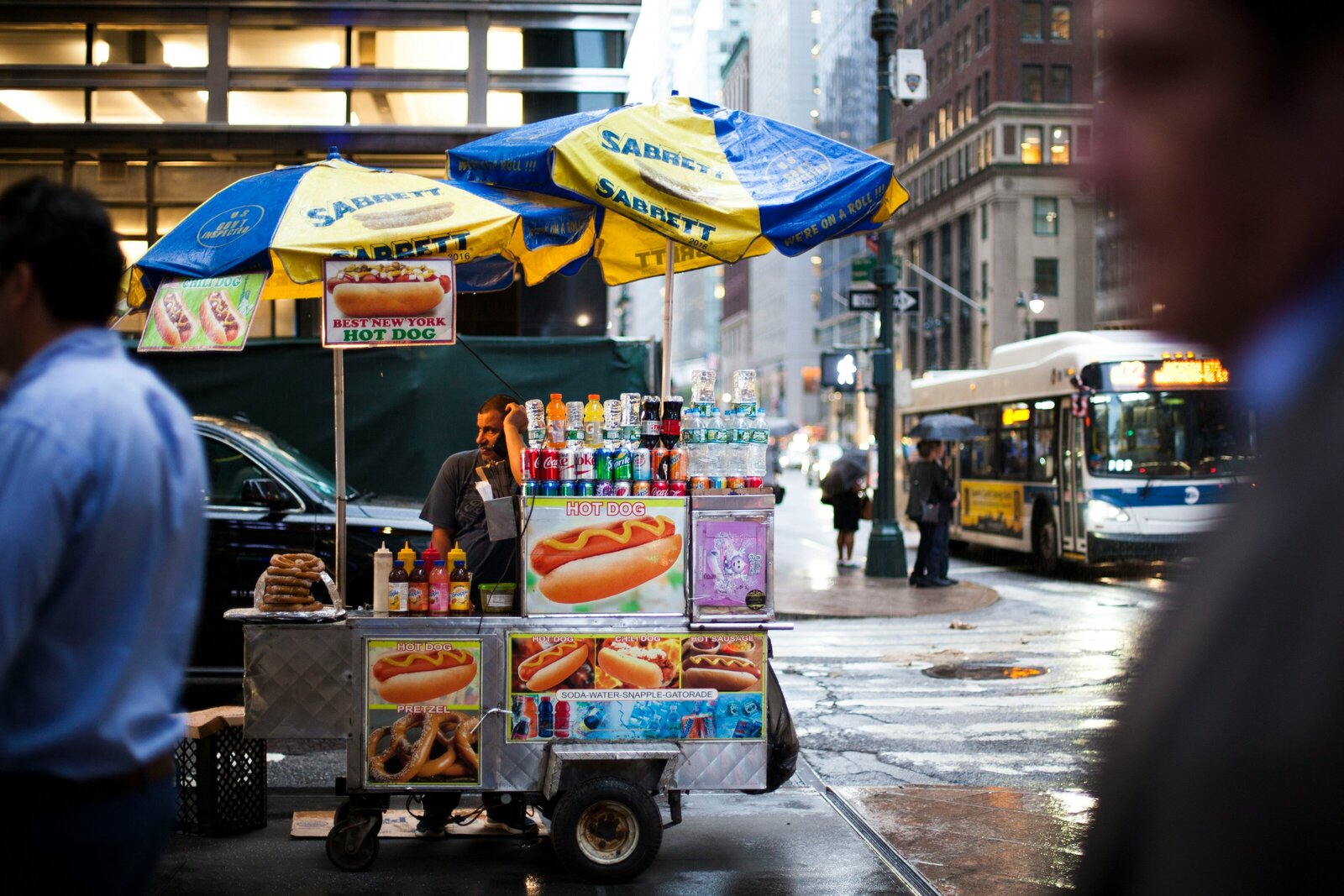 Iconic NYC street cart serving classic dirty water dogs with mustard, sauerkraut, or onions. Kelsey Parry Travel explores the best local food and drink spots.