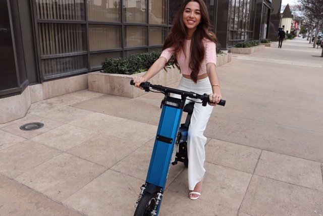 Actress Jessica Theodorou crusing the streets of LA on a Blue Go-Bike M2