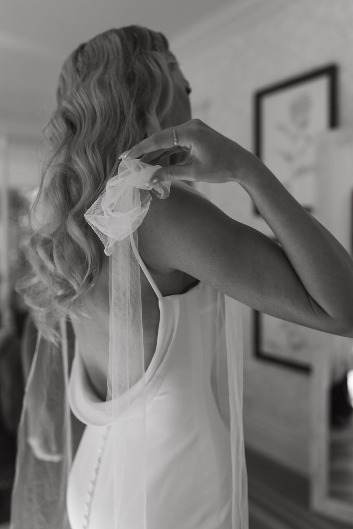 Bride holding dress taken by destination wedding photographers Erica Rochelle Photography
