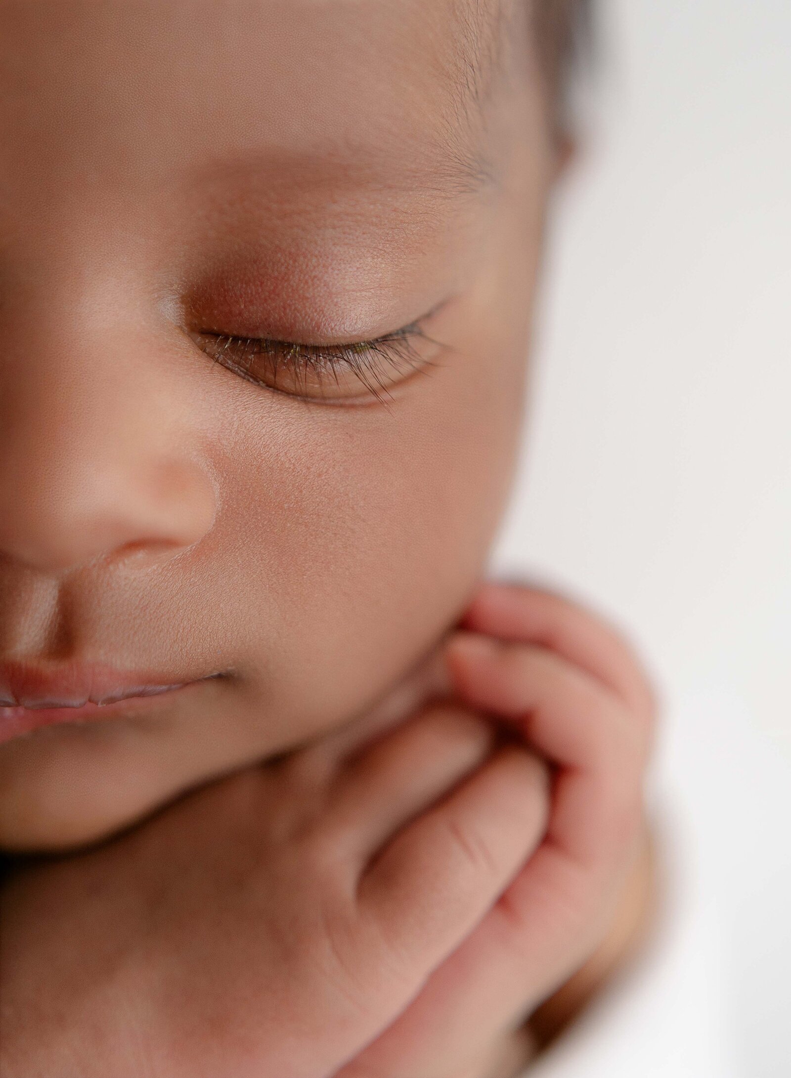 Macro photo showing baby's lashes. Newborn Photography session photographed at Jenni Nikki's photo studio in Woodstock, GA, near Marietta.