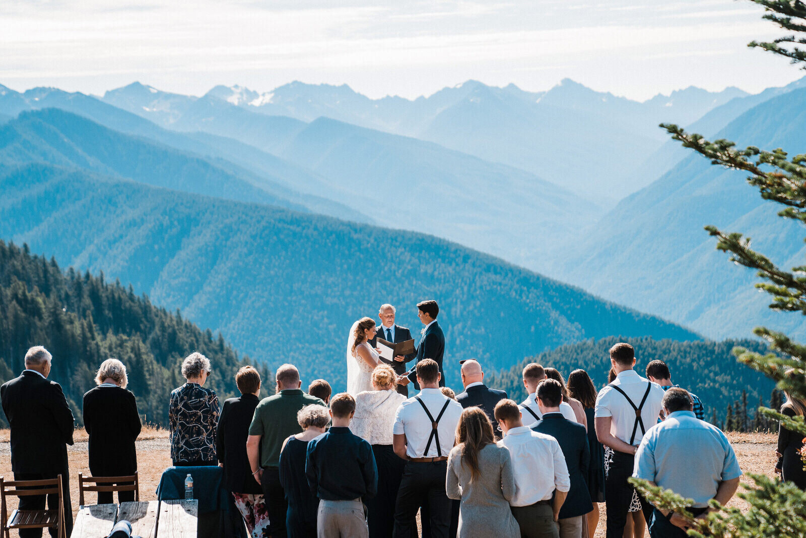 A bride and groom say their vows on top of Olympic National Park's Hurricane Ridge on a bright autumn day