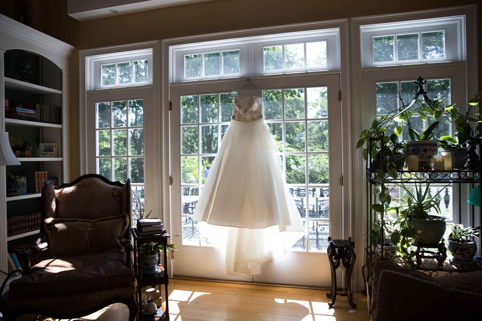 Wedding gown, backlit in a french door.  Private Estate Wedding New Hope Pennsylvania 