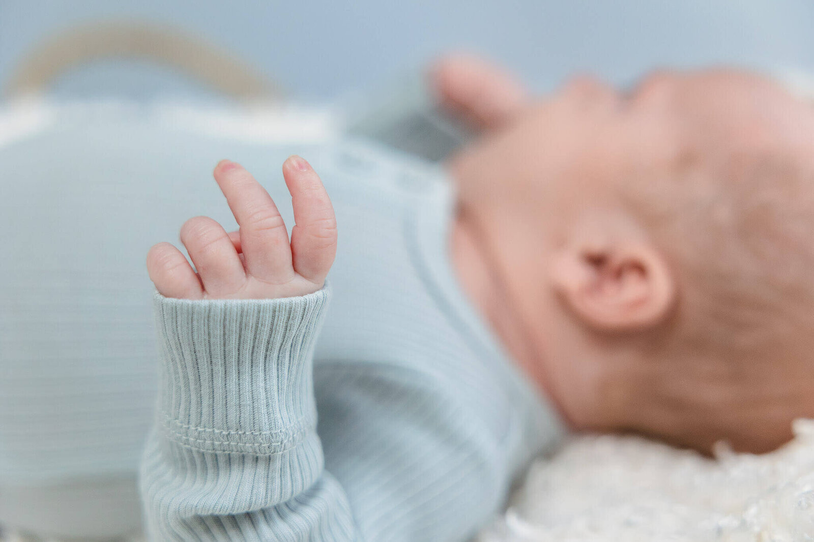 A close-up of a newborn boy's fingers.