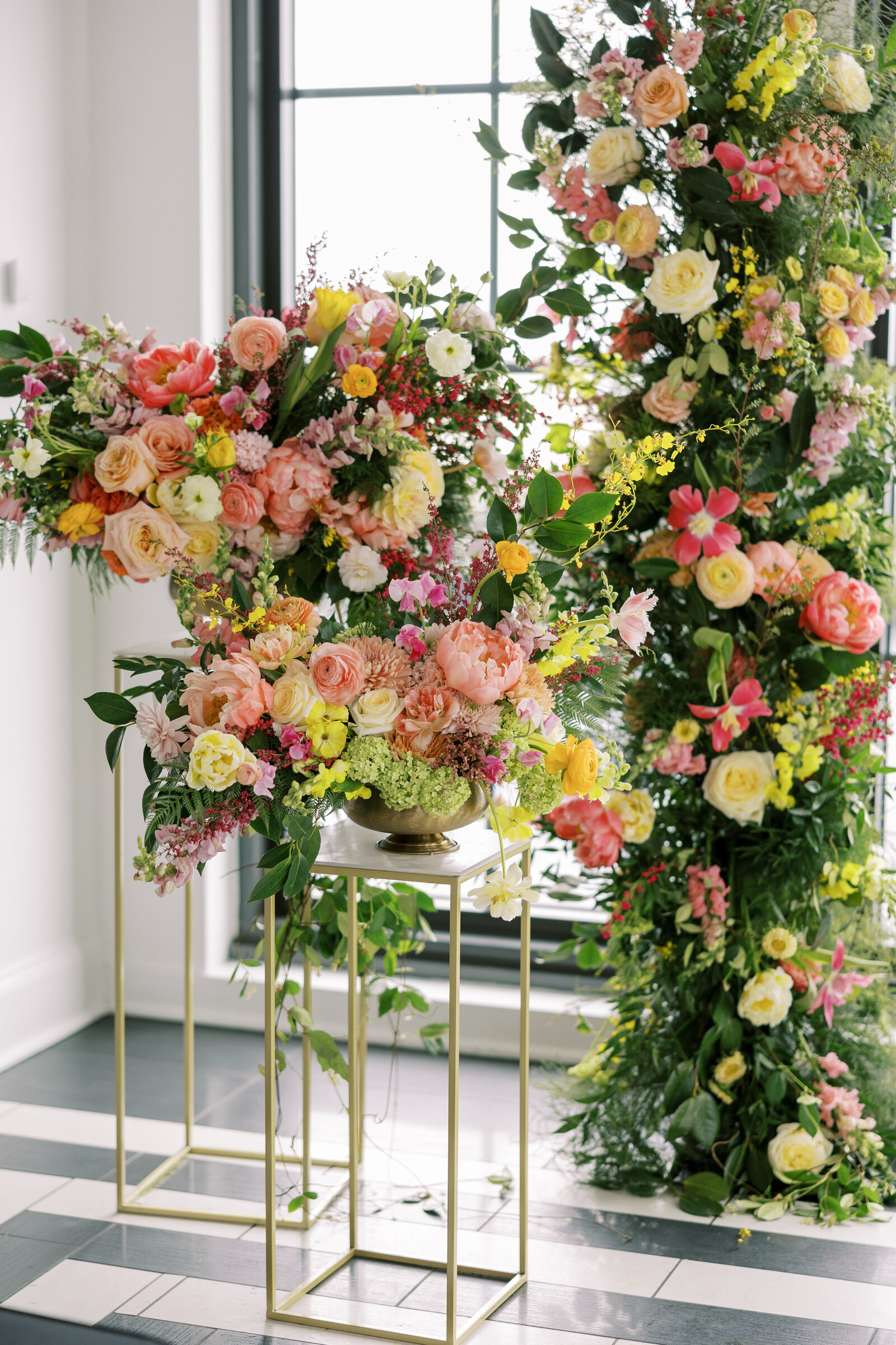 Wedding reception decor with colorful flower display