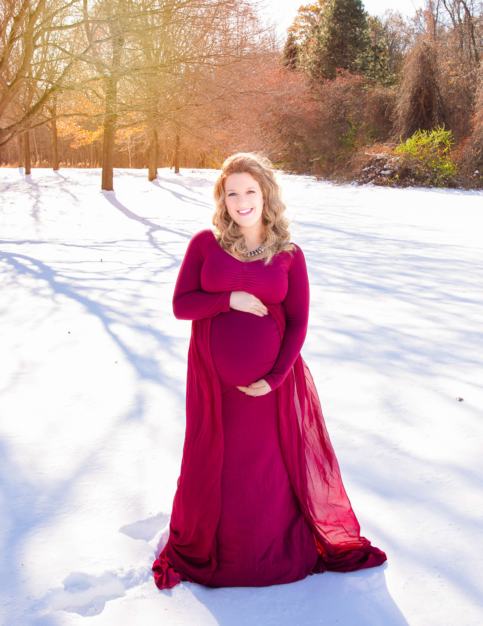 Pregnant woman posed at Basil Marella Park in Rochester, NY.