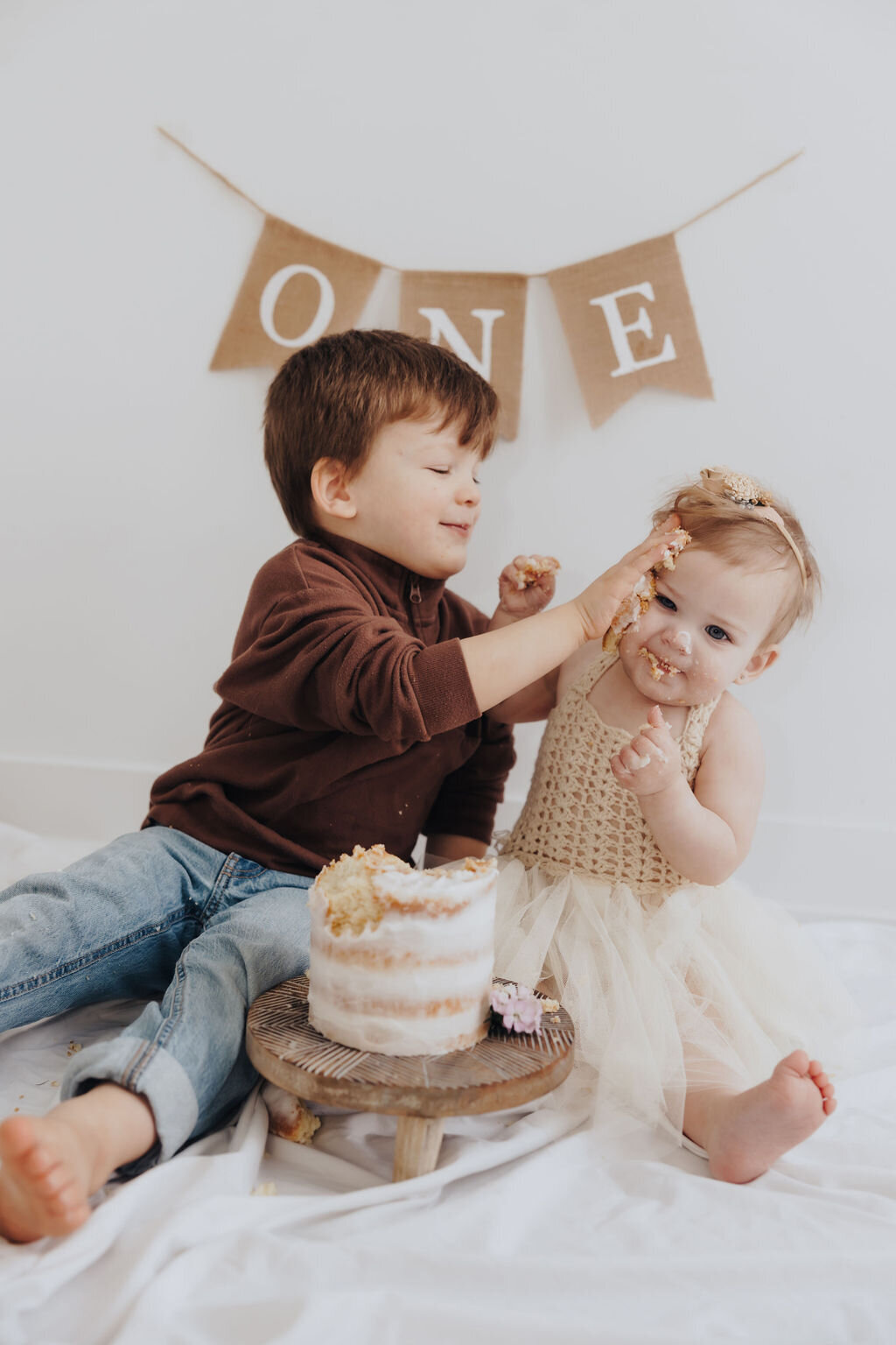 Kids playing with cake