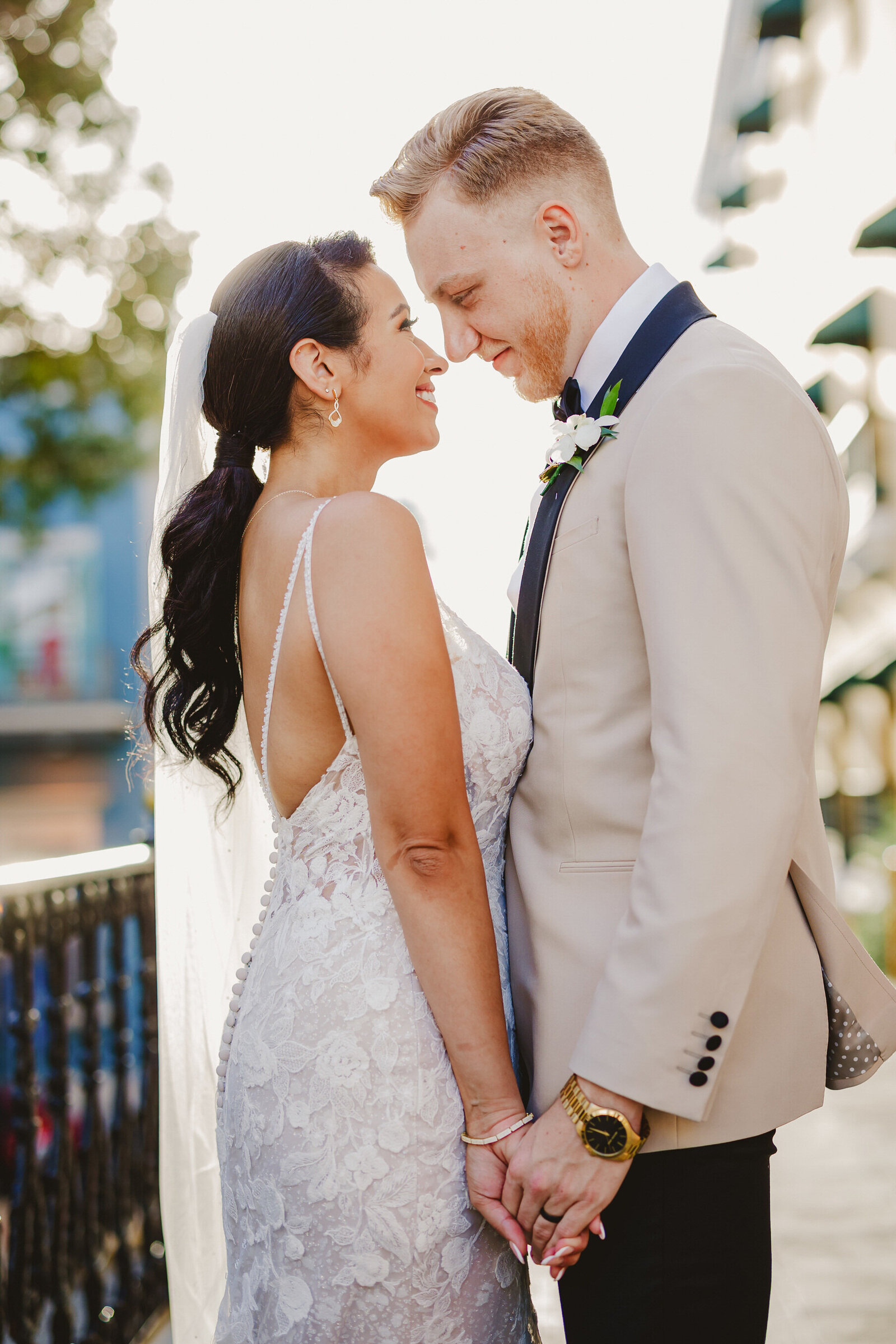 A bride and groom look into their eyes in front of El Convento Hotel, Old San Juan, Puerto Rico
