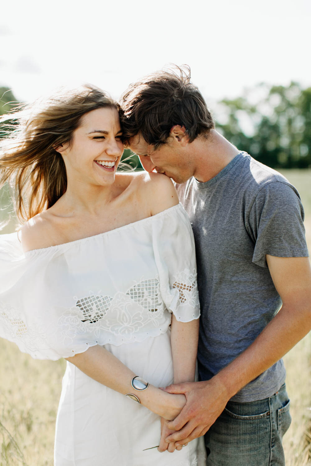 engaged couple flower field