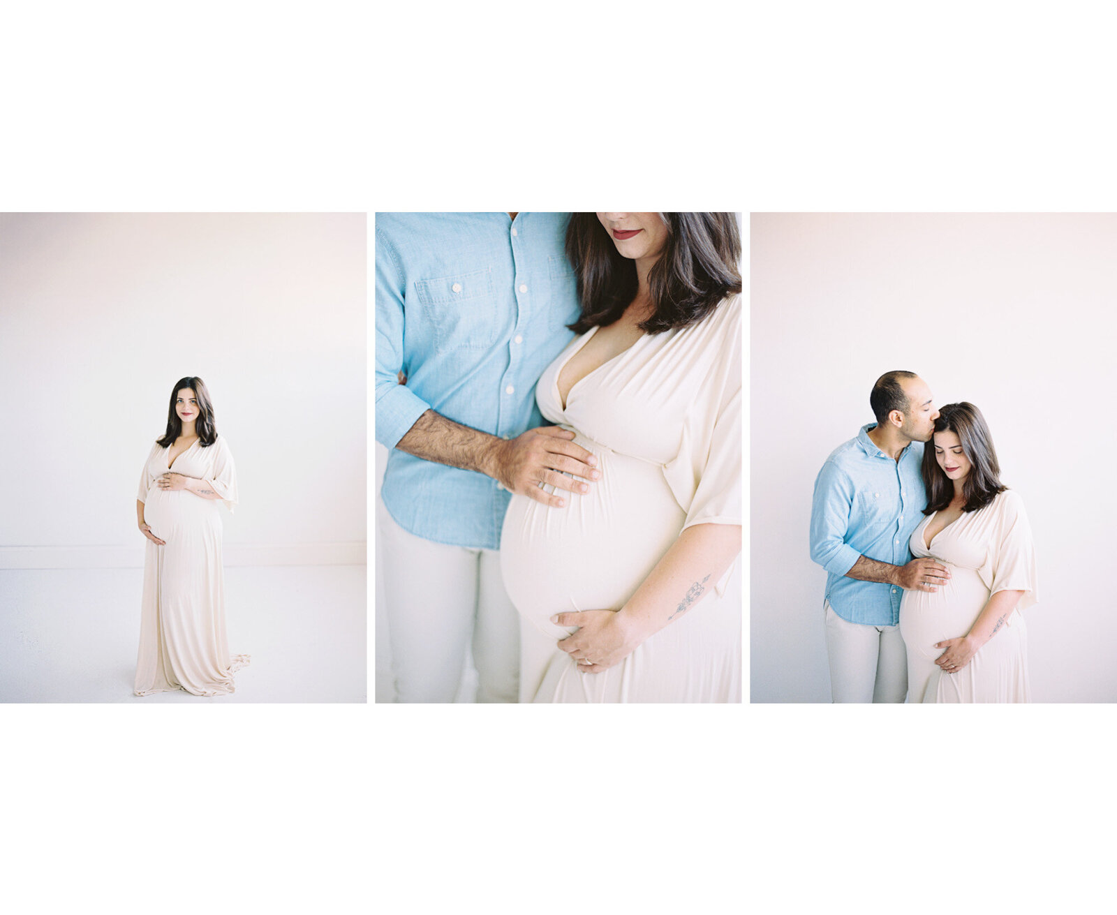 woman in white dress with a baby belly and her husband in a blue shirt kissing her head by Milwaukee Maternity Photographer