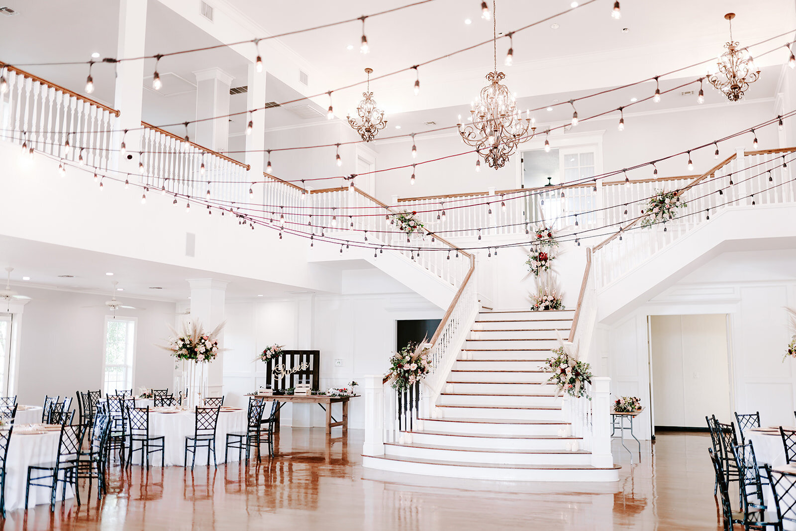 The view of the Kendall Point grand staircase before a reception.