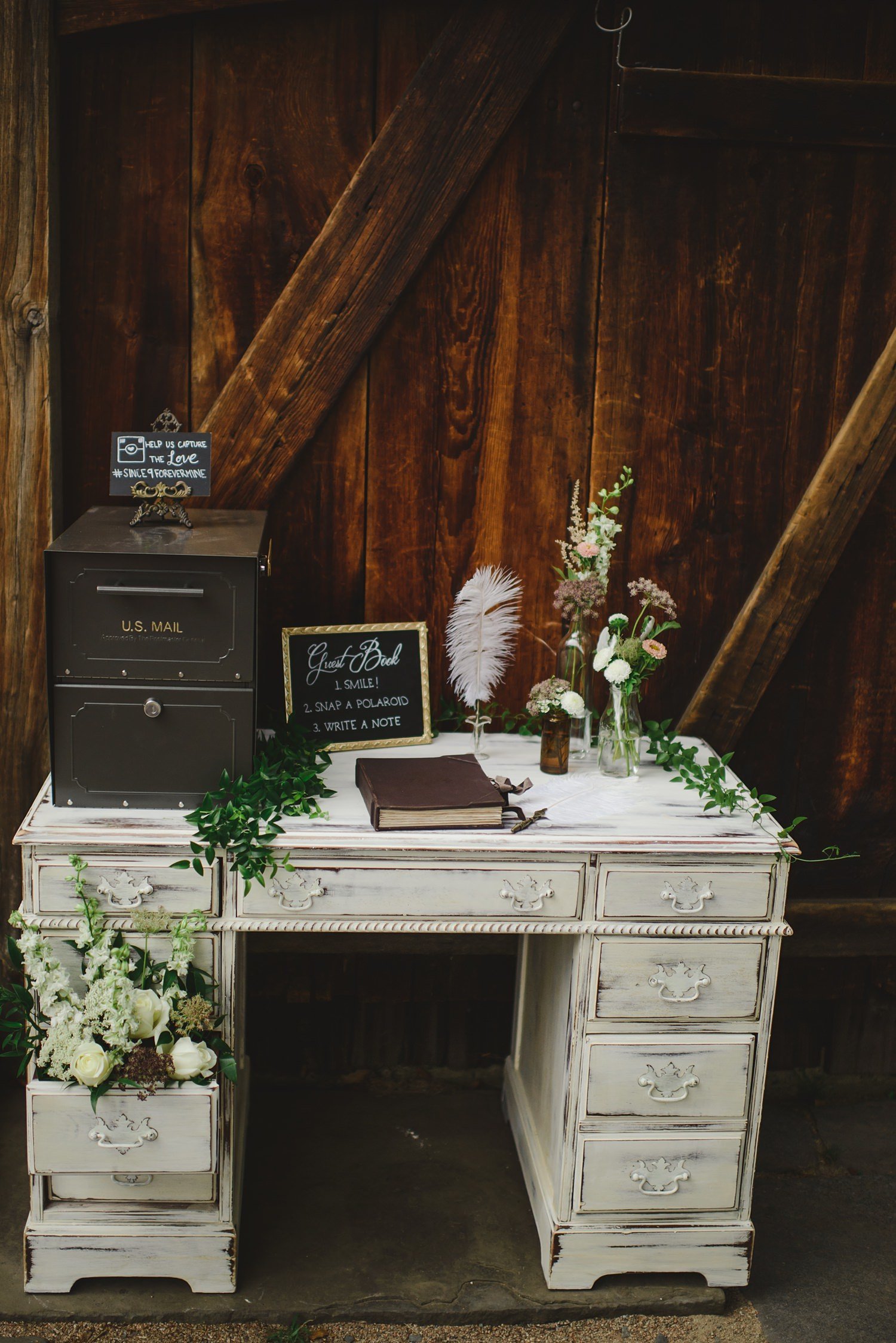 Rustic wedding guestbook on old desk at The Webb Barn in Wethersfield, CT