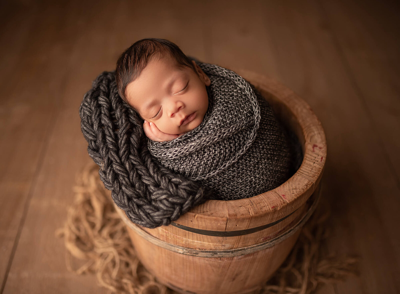 baby in a bucket