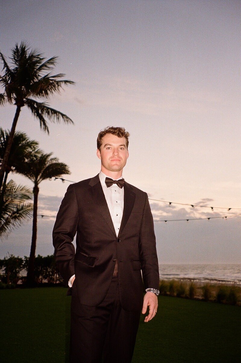 groom posing for one of the top wedding photographers in fort myers
